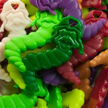A vibrant assortment of colorful bookworm charms, featuring shades of green, purple, pink, red, and more, perfect for promoting reading engagement in classrooms.