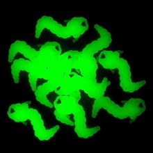 Glow-in-the-dark glow worm charms perfect as reading incentives for youth, showcasing multiple green glowing worms in a fun and engaging display.