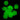 Glow-in-the-dark charms in playful shapes, ideal for school spirit awards, showcasing a vibrant green hue against a dark background.